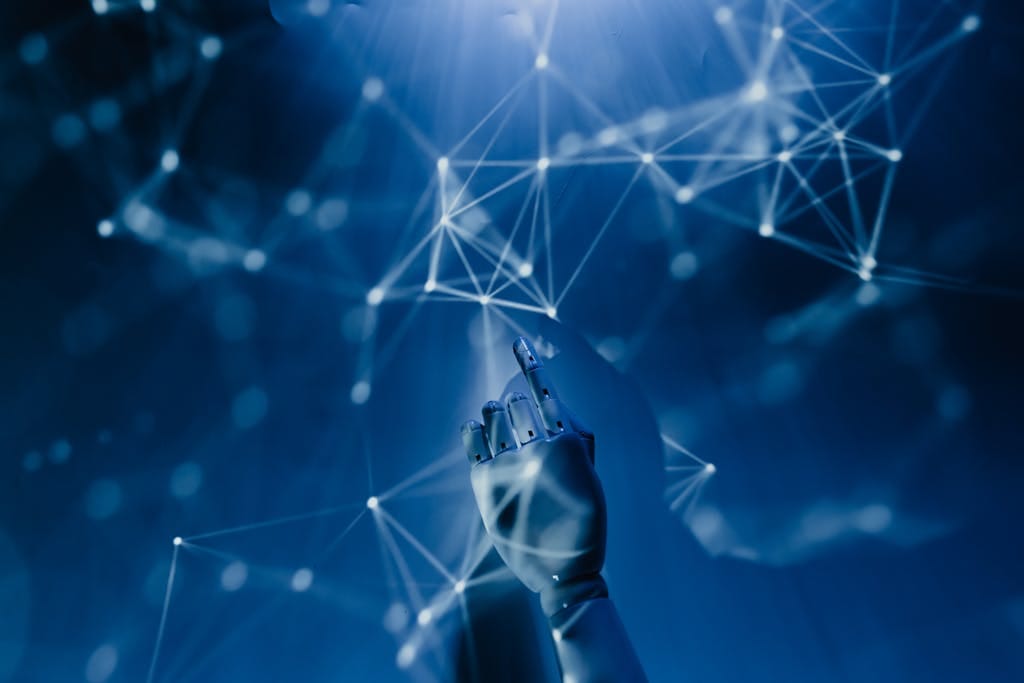 Using AI in Your Service-Based Business A robotic hand reaching into a digital network on a blue background, symbolizing AI technology.